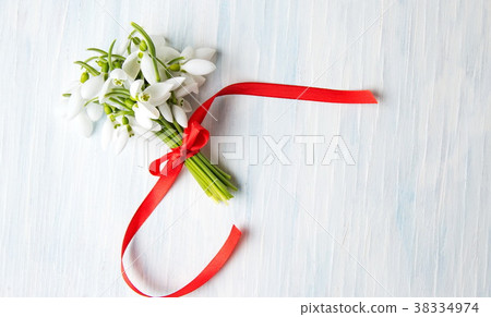 Fresh snowdrops bouquet on wooden background Fresh snowdrops bouquet on wooden background 38334974
