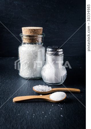 Different types of salt with spoons and jars Different types of salt with spoons and jars 38334985