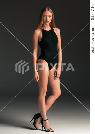 Fashion woman portrait. Beautiful young model in a Fashion woman portrait. Beautiful young model in a 38335216