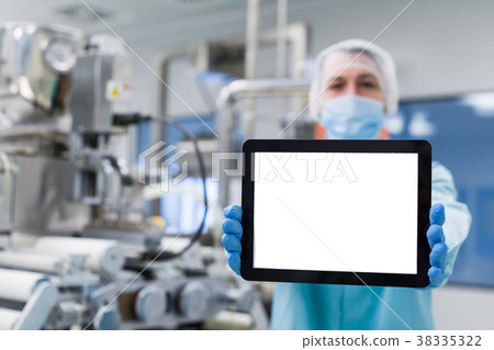 scientist near steel machine hold empty tablet scientist near steel machine hold empty tablet 38335322