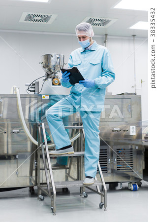 scientist work with big metal machine on ladder scientist work with big metal machine on ladder 38335432