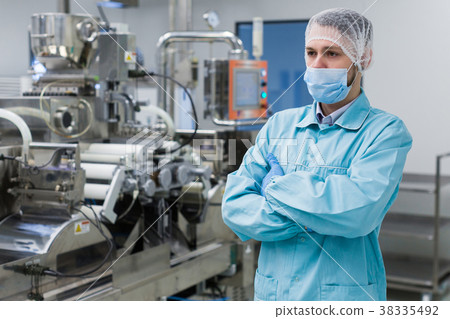 plant picture, factory worker is standing near plant picture, factory worker is standing near 38335492