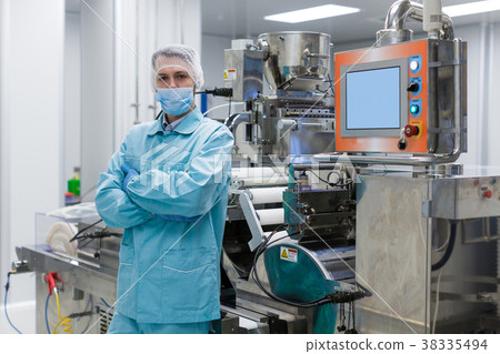 plant picture, factory worker is standing near plant picture, factory worker is standing near 38335494