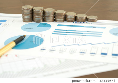 Business chart with paper clips, coins and pen Business chart with paper clips, coins and pen 38335671