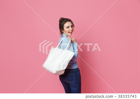 Cheerful casual woman with bag 38335743
