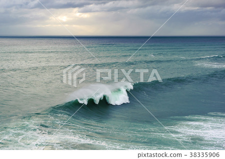 Huge ocean wave breaking in Nazare, Portugal Huge ocean wave breaking in Nazare, Portugal 38335906