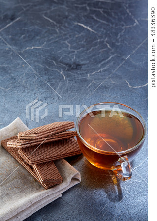 Vertical picture of a glass cup of black tea with Vertical picture of a glass cup of black tea with 38336390