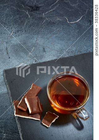 Vertical picture of a glass cup of black tea with Vertical picture of a glass cup of black tea with 38336428
