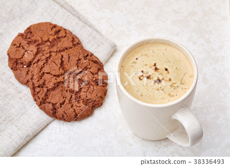 Cup of coffee and biscuit isolated on the white Cup of coffee and biscuit isolated on the white 38336493