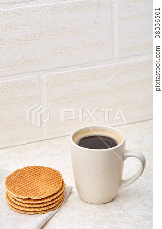Cup of coffee and waffles isolated on the white 38336501