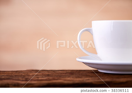 Side close up view of half a tea cup and saucer on 38336511