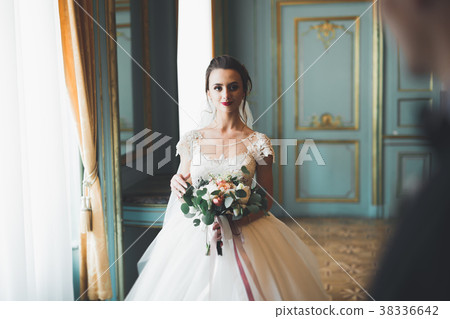 Perfect couple bride, groom posing and kissing in 38336642