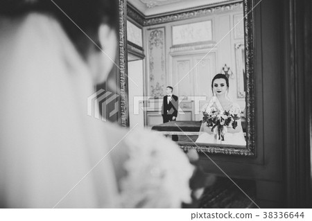 Lovely happy wedding couple, bride with long white Lovely happy wedding couple, bride with long white 38336644