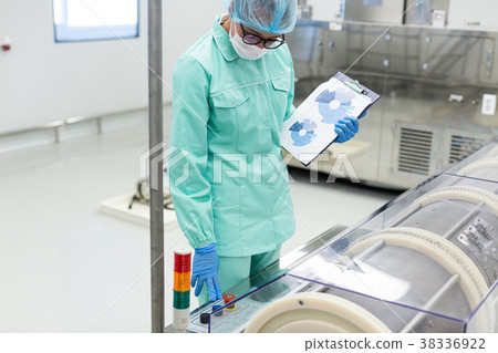 science worker compares readings of equipment science worker compares readings of equipment 38336922