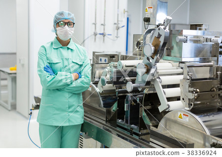 scientist is standing near machine with shafts scientist is standing near machine with shafts 38336924
