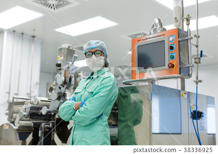 factory worker stand near control panel factory worker stand near control panel 38336925