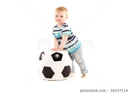 little boy plays with a soccer ball little boy plays with a soccer ball 38337514