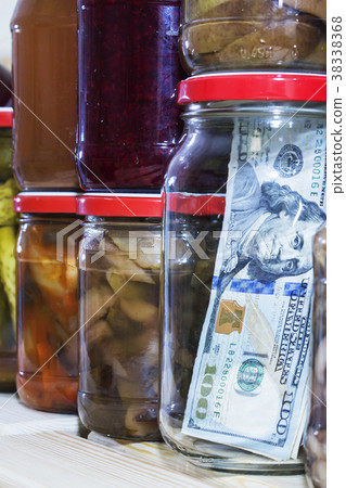 dollar in a glass jar on the background of canned dollar in a glass jar on the background of canned 38338368