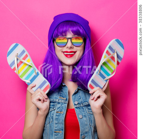 Girl with purple hair and with rainbow eyeglasses and shoes Girl with purple hair and with rainbow eyeglasses and shoes 38338806