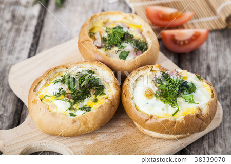 Scrambled eggs with cheese and bacon Scrambled eggs with cheese and bacon 38339070