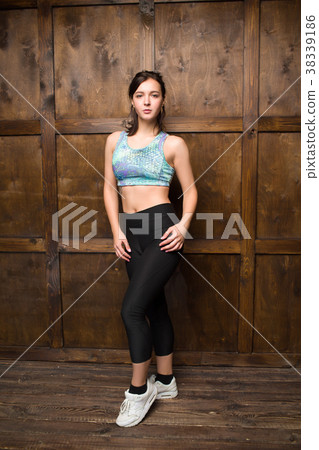 Beautiful young sportswoman in sportswear Beautiful young sportswoman in sportswear 38339186