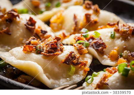 Dumplings with meat, onion and bacon. Dumplings with meat, onion and bacon. 38339570