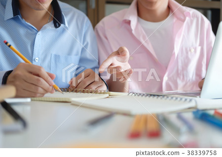 Education concept. Tutor books with friends. 38339758