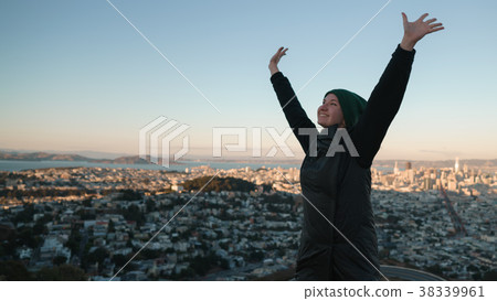 teen girl enjoys sunset on Twin Peaks at Sun 38339961