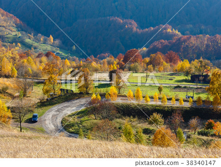 Dirty secondary road in autumn Carpathians Dirty secondary road in autumn Carpathians 38340147
