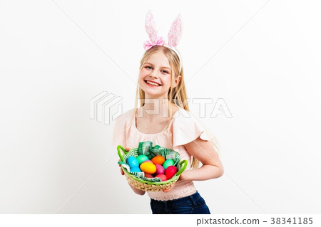 Teenage girl holding Easter eggs 38341185