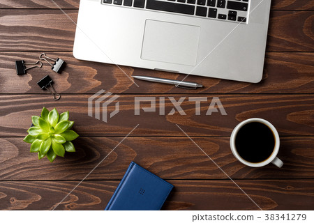 Laptop with office accessories on wooden table 38341279