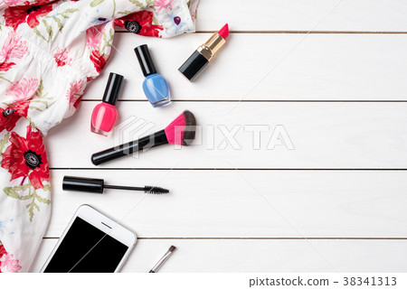 Makeup products on white wooden table Makeup products on white wooden table 38341313