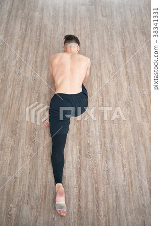 Handsome ballet dancer sitting on a splits Handsome ballet dancer sitting on a splits 38341331