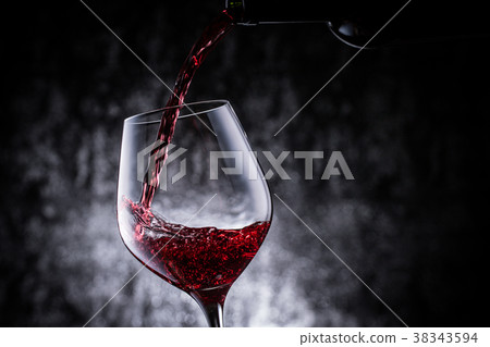 Pour red wine 38343594