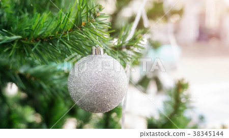 silver ball hanging on a Christmas tree. silver ball hanging on a Christmas tree. 38345144