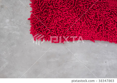 Gray concrete floor with red rug fluffy carpet Gray concrete floor with red rug fluffy carpet 38347863