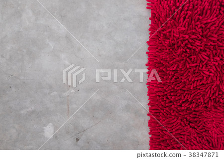 Gray concrete floor with red rug fluffy carpet Gray concrete floor with red rug fluffy carpet 38347871