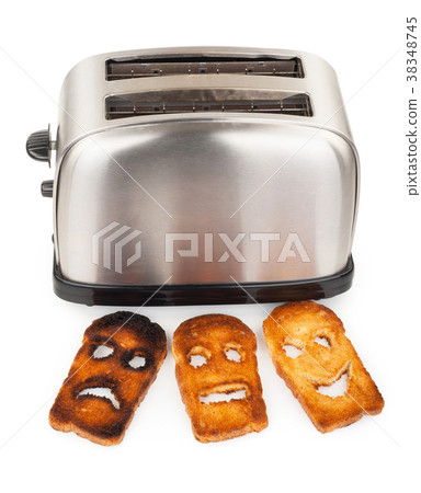 Toasts With Smiley Face In Toaster Stock Photo