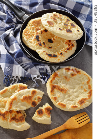 freshly fried pita bread in skillet 38349865