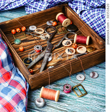 Sewing buttons and spools of thread Sewing buttons and spools of thread 38351620