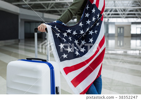 Woman keeping her arm on suitcase 38352247