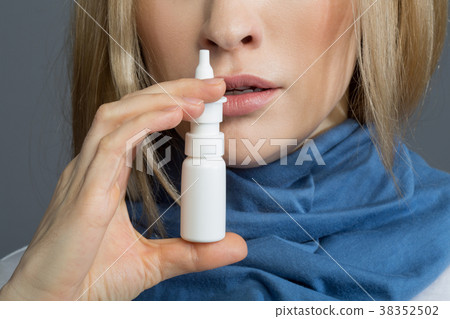 Sick woman taking care of her health 38352502