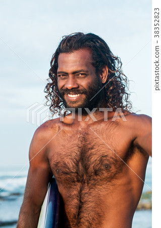 Portrait of a smiling surfer Portrait of a smiling surfer 38352823