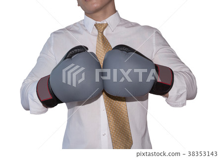 Businessman with boxing gloves for corporate  38353143
