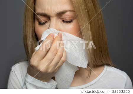 Displeased young female having cold 38353200