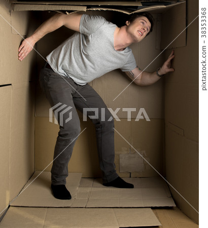 Young man is feeling discomfort inside small 38353368