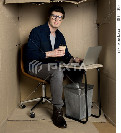 Young businessman is laboring in confined 38353392