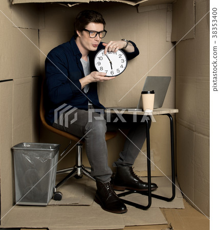 Young positive manager is keeping clock 38353400