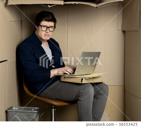 Young miserable manager is working in cramped 38353425