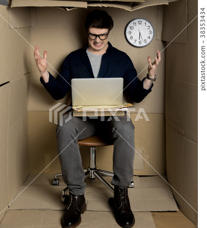 Irritated businessman is laboring in confined 38353434